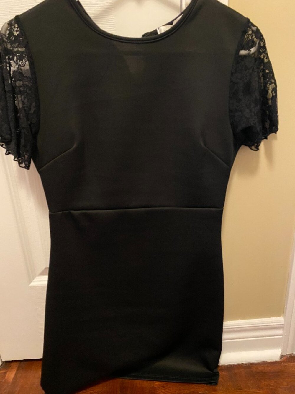 Black dress with lace sleeves.